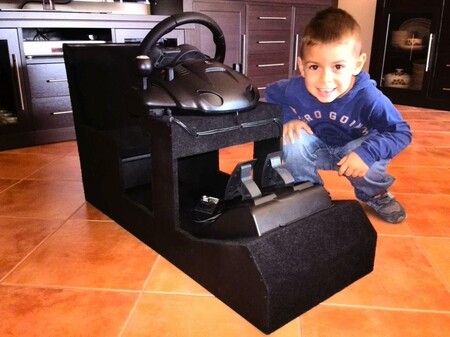 Abel with the cockpit that his father made for him when he was 4 years old